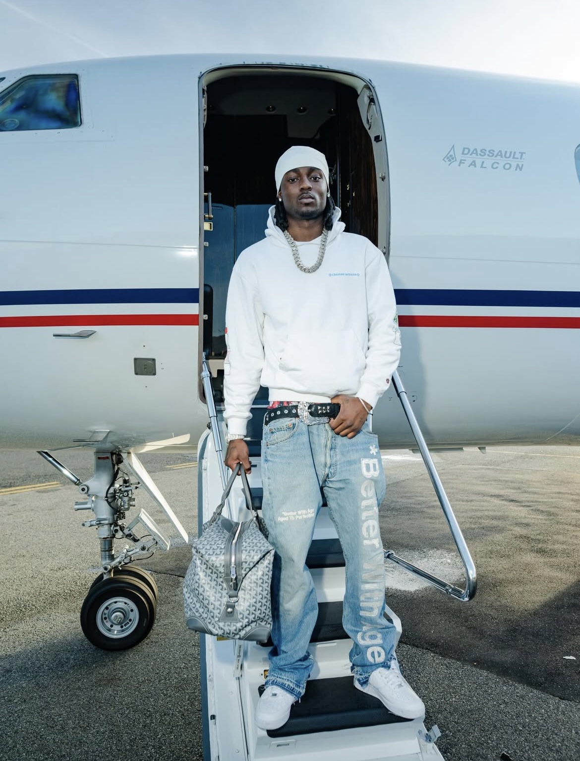 Kyle Richh in luxury streetwear on private jet